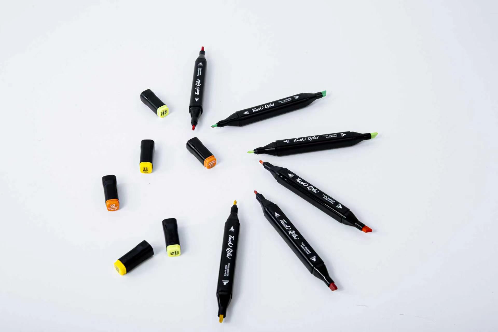 Colour markers arranged across a white surface